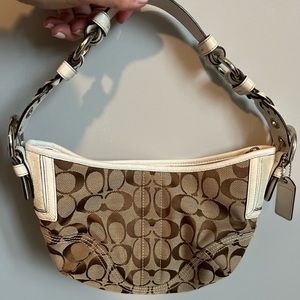 COACH signature hand bag brown with white trim.